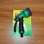 Green handheld hose spray nozzle for garden and outdoor cleaning